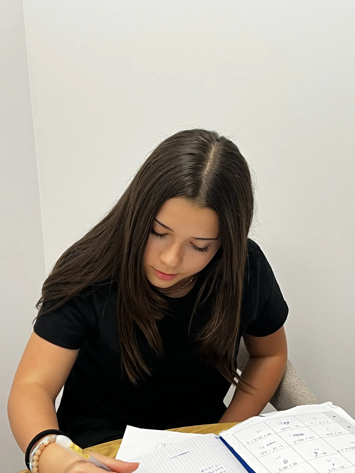 Yasemin concentrating on her written work at Pebble House